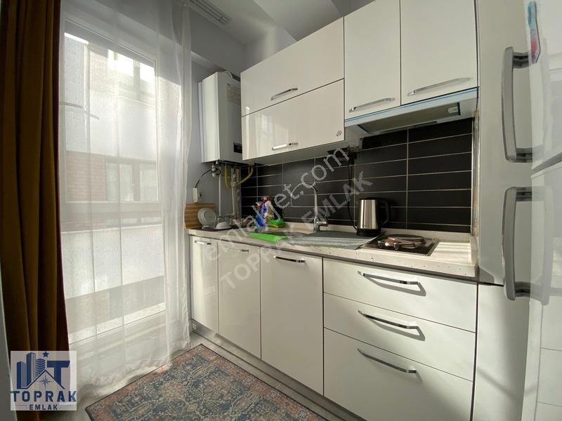 Toprak Emlak'tan Cadde Üzeri / Ara Kat / Kiracılı / Satılık 1+1 — fotoğraf 7